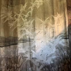 100 silk-embroidered cranes symbolizing peace.