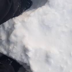 Trudging through the hill of snow in the high wind