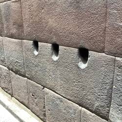 Holes for previous drainage pipes.