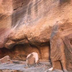 Broken carved sculpture depicts a trader, see the hooves of the camel that stands beside him