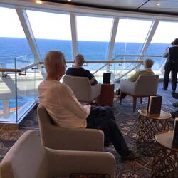 Relaxing in the Explores lounge on Deck 8.