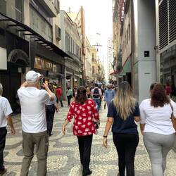Walking through shopping area closed to vehicles.