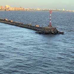 Lots of people fishing on the breakwater.
