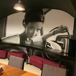 Large poster in dining room at hotel.