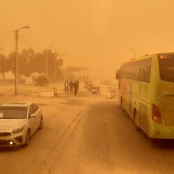 Stopped at a checkpoint... road closed by sand