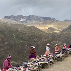 Cold looking vendors by the side of the road.