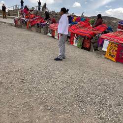 Vendors braving the cold hoping that we will buy their shawls and blankets.