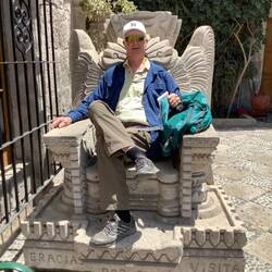 Ornate chair carved out of stone.