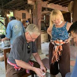 Soaking grated coconut meat to make coconut milk for dessert