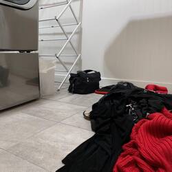 The laundry room serves as the quarantine space for our travel clothes.