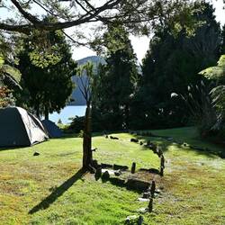 Somewhat squishy camping at Lake Paringa Lodge (Linda & I found the high ground)