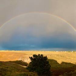 The arroyo and plains view we get to enjoy from our deck ... though not always with a rainbow.