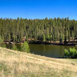 Lake Sapphire with Pikes Peak and the Front Range in the distance — Farish Rec Area, CO.