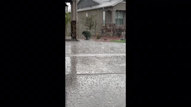 Watching the hailstorm from our covered porch — Colorado Springs, CO.