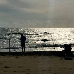 Angler am Strand