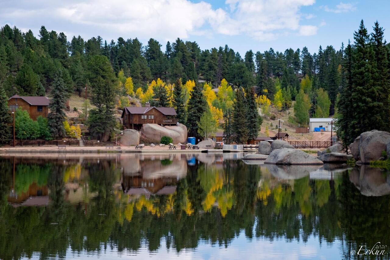 A "double the pleasure" reflection of the lodge and facilities on Grace Lake — Farish Rec Area, CO.