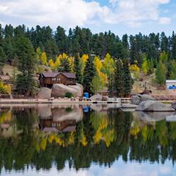A "double the pleasure" reflection of the lodge and facilities on Grace Lake — Farish Rec Area, CO.