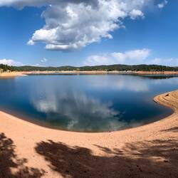 In June, the water was nearly to the edge of the trees on the right — Rampart Reservoir, CO.