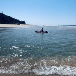 Lacey safe onshore. Me paddling furiously.