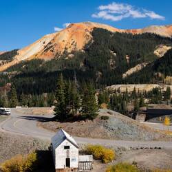Red Mountain #3 serves as the background for the Idarado Mine Overlook — SJ Skyway, CO.