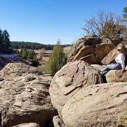 Enjoying the sunshine after scrambling over the boulders — Castlewood Canyon SP, CO.