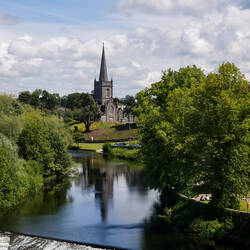 St Paul's Church and the River Suir from the banqueting hall — Cahir Castle ... Cahir, Ireland.