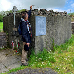 Adding to the rock stash at the Crean family crypt — Annascaul, Ireland.