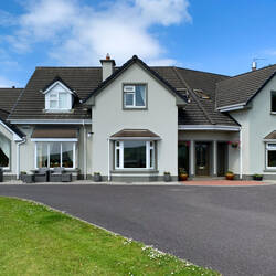 Our room is above the bay window to the right of the doorway — Tower View B&B ... Dingle, Ireland.