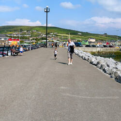 A wide promenade along the waterfront is perfect for our stroll — Dingle, Ireland.
