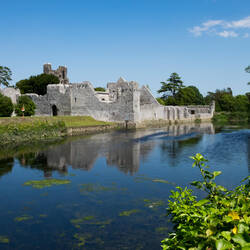 The ruins of Desmond Castle along the River Maigue — Adare, Ireland.