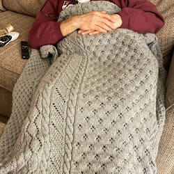 Mui didn't wait to use the afghan until he was in bed! — Colorado Springs, CO.