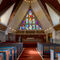 Beautiful painted woodwork and sculptures decorate Hammerfest Kirke — Hammerfest, Norway.