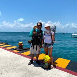 Happy backpackers reaching the Isla Mujeres