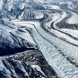 A heavily crevassed glacier — Peak Experience Flight Seeing, Alaska.
