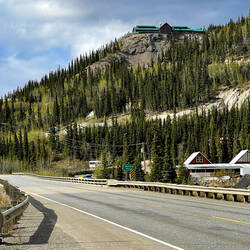 The Grande Denali Lodge sits atop the ridge with the Alpenglow Restaurant facing this way — Alaska.
