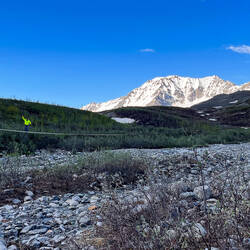 Mui crossing the bridge back — Gulkana Glacier Hike, AK.