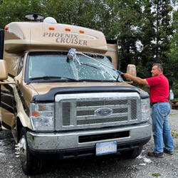 Mui giving the Cruiser a much-needed bath — Wrangell View RV Park in Chitina, AK.