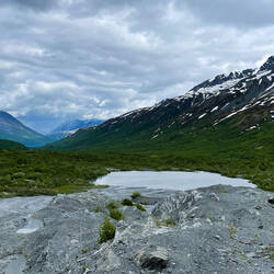 The glacier lake with a view of the valley and mountains — Worthington Glacier SRS, AK.