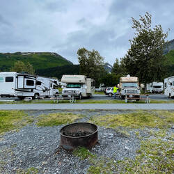 Tucked into our waterfront site ... with our fire ring in the foreground — Resurrection South Cg.