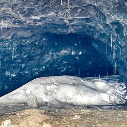 Amazing color of the compacted ice inside the cave — Miles Lake, AK.