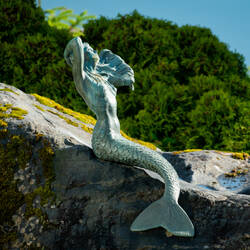 Mermaid sunning herself on the grounds of the Reluctant Fisherman Inn — Cordov