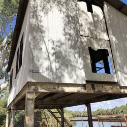 Flood heights on shed wall. 1983 and 1986
