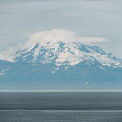 Mount Redoubt is in the Aleutian Range ... it last erupted in 2009.