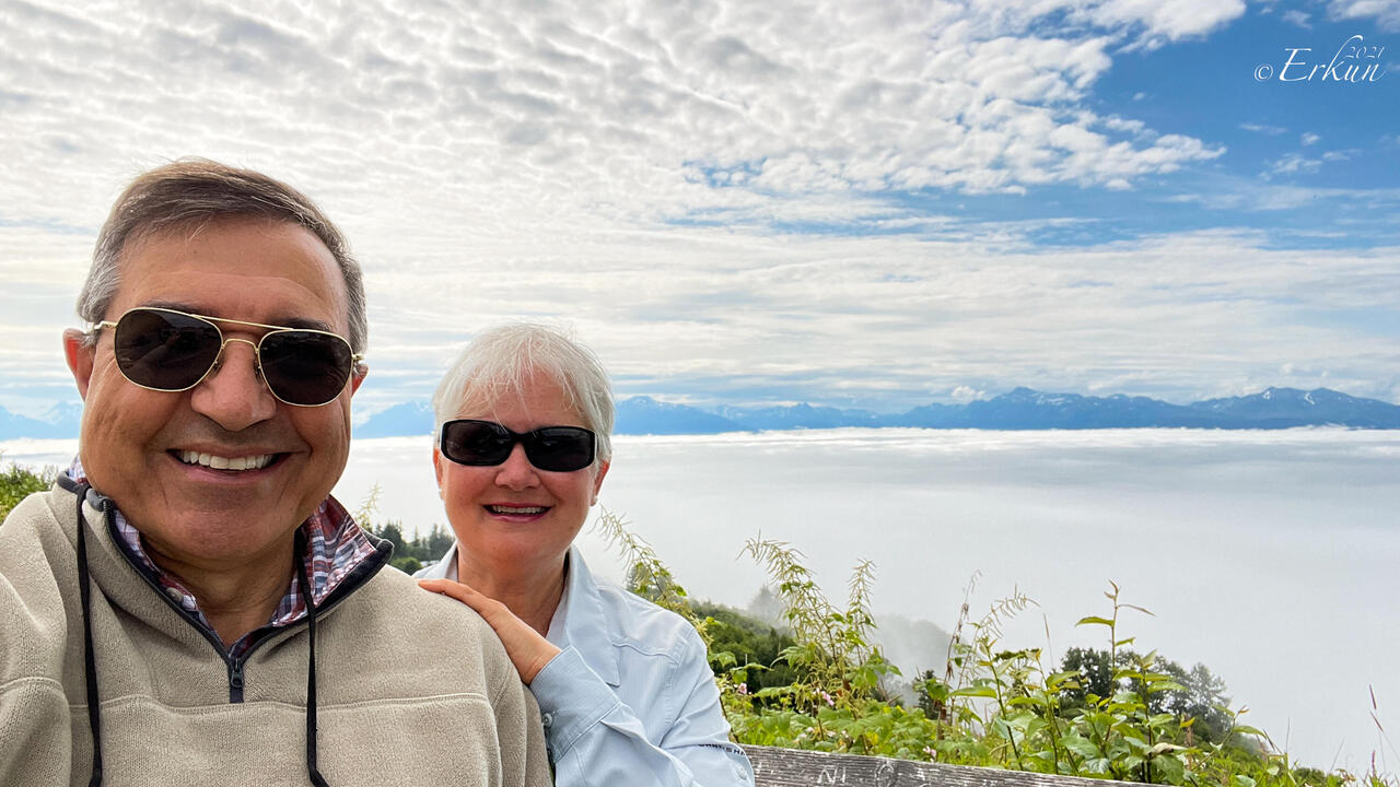 A "Baycrest Overlook" selfie with Homer and the Spit hidden by low-lying clouds — Homer, AK.