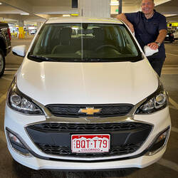 Colorado license plate on our rental ... that's quite a coincidence — SeaTac Car Rental Facility, WA