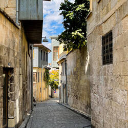 A narrow street lined with stone houses — Bey Mahallesi ... Gaziantep.