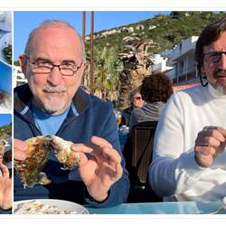 Deniz and Murat are cleaning up the fish ... head and tail and all — Karaburun ... İzmir, Turkey.