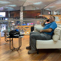 Having made himself comfortable, Mui's saying his goodbyes by phone — THY BizClass Lounge @ IST.