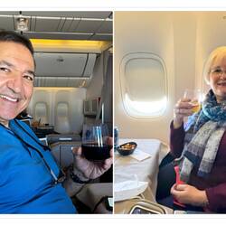 Enjoying our adult beverages — Aboard TK33 ... somewhere over Romania.