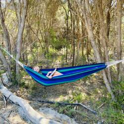 Millie doing schoolwork in the hammock